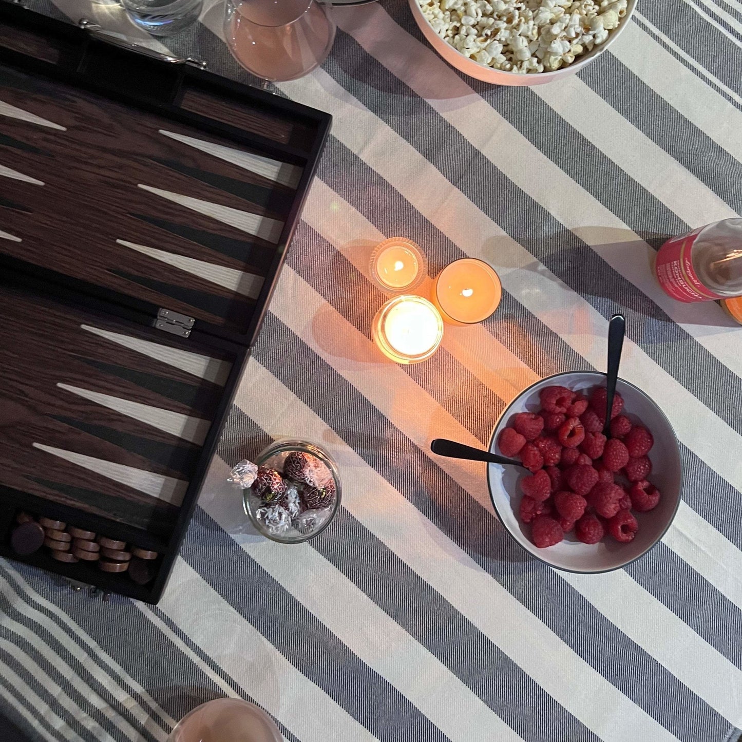 romantic games and snacks set up with a SENDE black turkish towel as the table cloth - SENDE peştemal duo set - sende self-care essentials